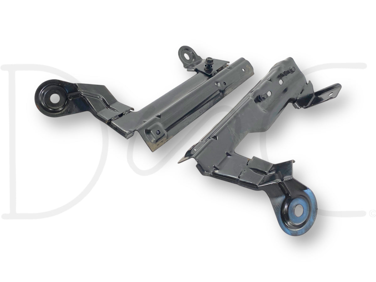 Pair of used 99-07 Ford F250 F350 Center Console Jump Seat Mount Bracket Base OEM Brackets with light wear, black metal construction for Super Duty truck fitment.
