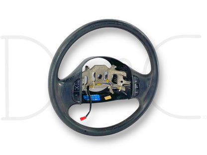99-02 Ford F250 F350 Steering Wheel W/ Cruise Buttons OE Black 1C3A-3600-Aaw with used condition, light wear, and surface blemishes from steering wheel cover, suitable for Ford Super Duty trucks.