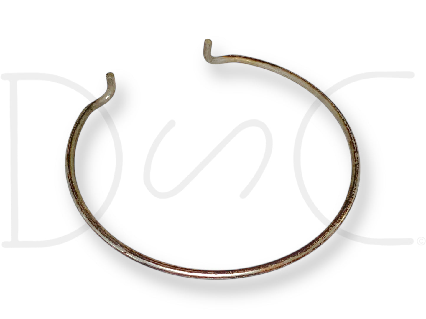 99-04 Ford F250 F350 4WD 4X4 Front Axle Locking Hub Snap Ring Retainer made of metal, showing slight wear, used for secure fitment in diesel truck axle assemblies.