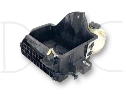 08-10 Ford F250 F350 Battery Tray Windshield Washer Fluid Tank Reservoir, used with light wear, featuring a broken corner on the AC line holder clip, compatible with 2008-2010 F-250, F-350, F-450, and F-550 models, made from durable black plastic with attached white fluid tank.