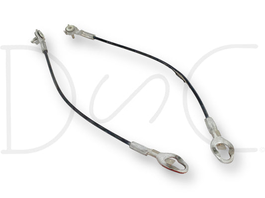 08-16 Ford F250 F350 Super Duty Tailgate Cable Set OEM Support Straps Cables shown with visible wear and tear on cable sheathing, designed for Ford F-250 and F-350 trucks from 2008 to 2016, featuring durable metal ends and OEM quality for reliable tailgate support.