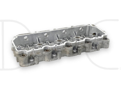03-05 Ford F250 F350 6.0 6.0L Diesel Rocker Box Arm Housing 18MM 1843351C2 OE, used part with light wear removed from a 2004 Ford F-250 King Ranch 6.0L Powerstroke engine, suitable for 2003-2005 Ford Super Duty trucks.