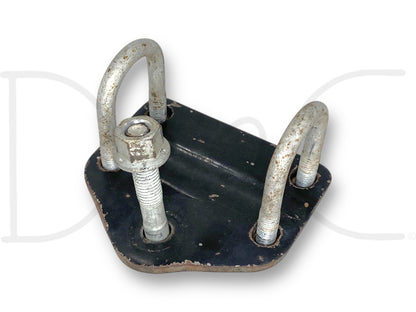 99-04 Ford F250 F350 Steering Damper Stabilizer Lower Mount Bracket OEM, used with light wear, featuring a black metal base plate with three silver U-bolts and one nut, compatible with 1999-2004 Ford F-250 and F-350 trucks including 6.0L Powerstroke models.
