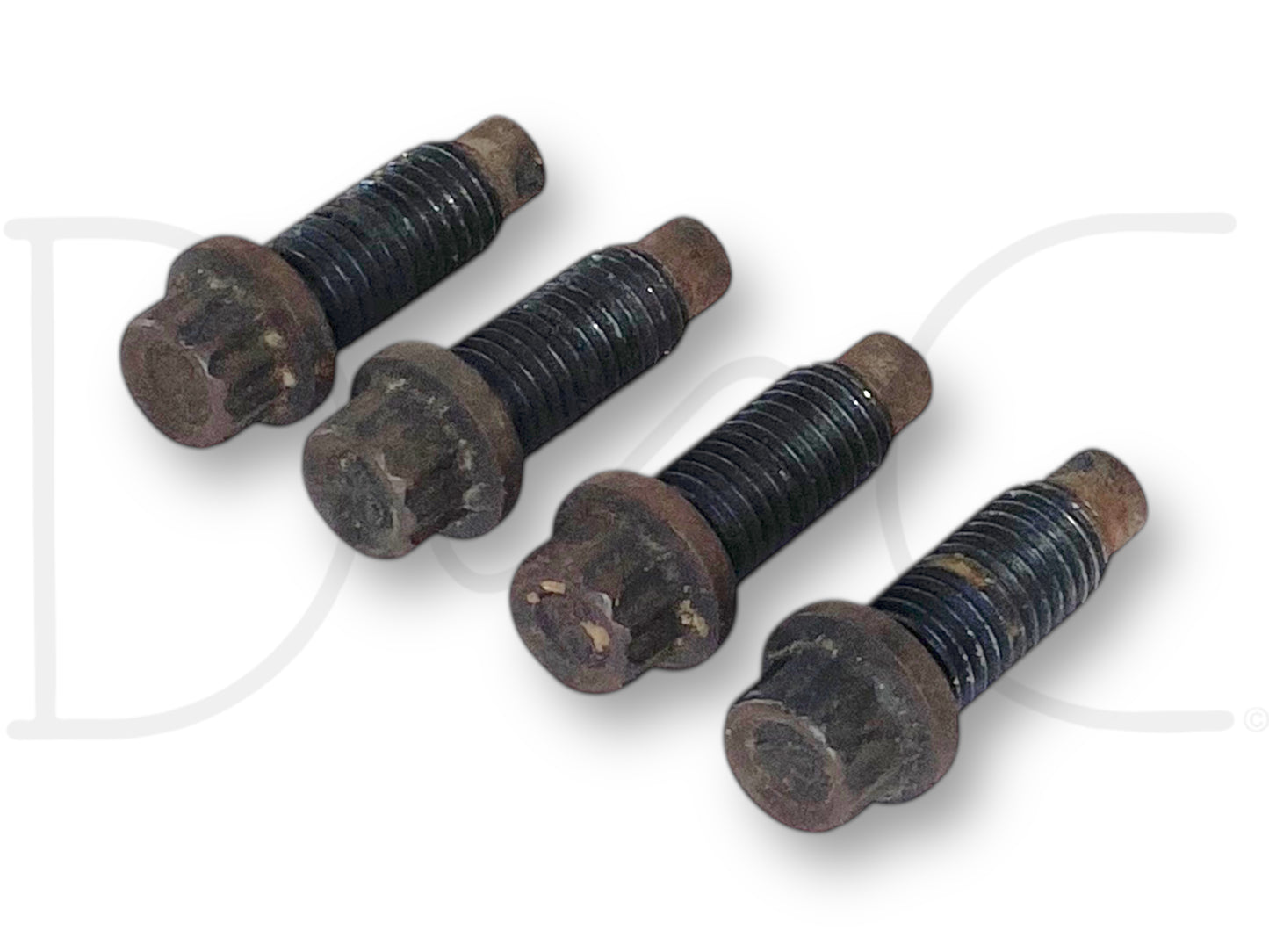 99-10 Ford Super Duty F250 F350 Driveshaft To Flange Bolts OEM Bolt Set (4) shown with light wear, used condition. Four black threaded bolts with rust spots on heads and tips, designed for fitment on 1999-2010 Ford Super Duty trucks including F-250, F-350, F-450, and F-550 models.