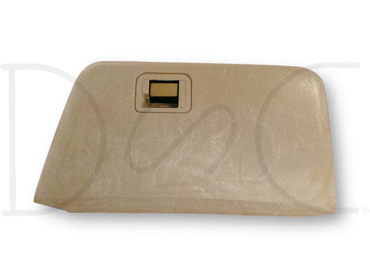 03-07 Ford F250 F350 Super Duty Tan Glove Box Storage Compartment in used good condition with light wear, compatible with 2003-2007 Ford F250, F350, F450, and F550 models, featuring a tan finish and a rectangular latch handle.