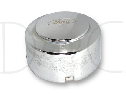 99-04 Ford F350 Super Duty Dually Rear Wheel Center Hub Cap Hubcap Chrome OEM with visible light wear, scratches, and surface blemishes, featuring the Ford logo, suitable for 1999-2004 Ford F-350 dually trucks.