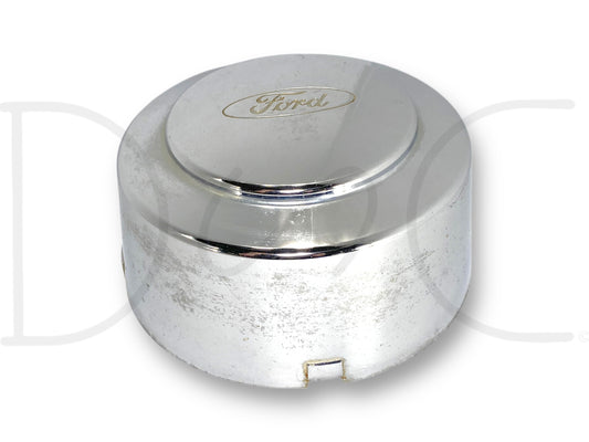99-04 Ford F350 Super Duty Dually Rear Wheel Center Hub Cap Hubcap Chrome OEM with visible light wear, scratches, and surface blemishes, featuring the Ford logo, suitable for 1999-2004 Ford F-350 dually trucks.