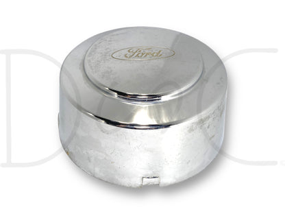 99-04 Ford F350 Super Duty Dually Rear Wheel Center Hub Cap Hubcap Chrome OEM with visible light wear, scratches, and surface blemishes, suitable for Ford Super Duty diesel models from 1999 to 2004, featuring chrome finish and Ford logo.