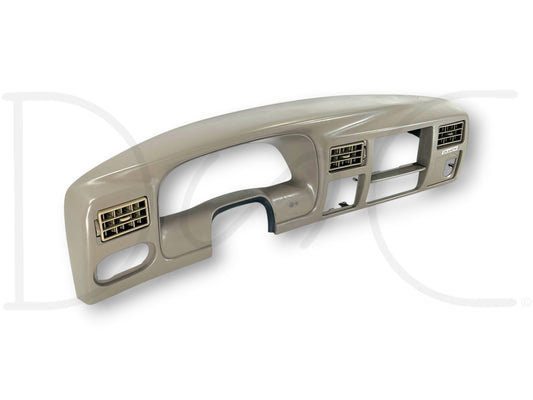 03-04 Ford F250 F350 King Ranch Dash Bezel Radio Cluster Trim Panel Tan OE with light wear and surface blemishes right of steering column for Super Duty trucks