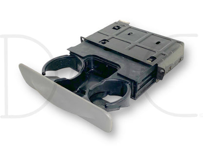 99-04 Ford F250 F350 Dash Cupholder Pull Out Assembly Gray OE *W/Out Insert* showing a used, good condition gray pull-out cupholder designed to fit models including 1999-2004 Ford F-250, F-350, F-450, and F-550 trucks.