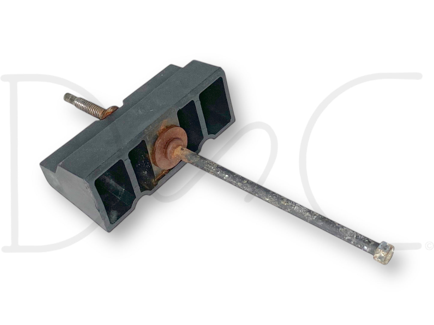 99-10 Ford F250 F350 Super Duty Battery Retainer Hold Down Bracket OEM used condition showing light wear, black plastic bracket with attached metal rod and rusty screw, compatible with 7.3L Powerstroke diesel Ford trucks from 1999 to 2010.