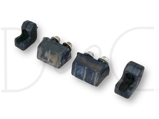 99-07 Ford F250 F350 Rear Tailgate Stop Bumper Pad Set OE Pads Bumpers shown as four black rubber bumpers, two with attached metal bolts, designed as used OE parts with light wear for 1999-2007 Ford F-250 and F-350 trucks.