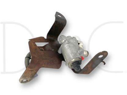 99-00 Ford F250 F350 2-Wheel ABS Anti Lock Brake Pump & Bracket W/Out Module used condition with light wear, featuring a rusted metal bracket and attached brake pump designed for 1999-2000 F-250 F-350 trucks, compatible with Ford 7.3L diesel models.