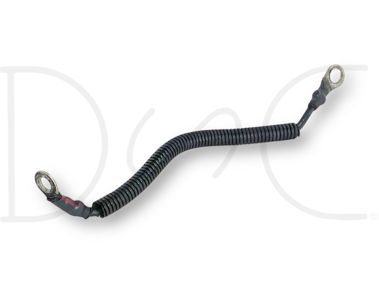 99-02 Ford F250 F350 7.3 7.3L Diesel AIH Air Intake Heater Ground Wire Cable OE used part with light wear, featuring a coiled black protective covering and metal ring terminals on both ends for secure connection in diesel engine systems.