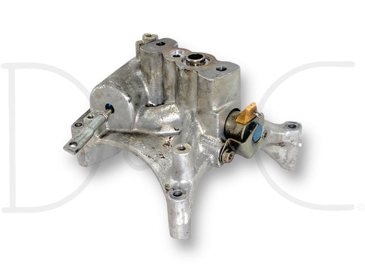 Used metal turbo pedestal with mounting holes and attached EBPV plug, showing signs of wear and blemishes, for 99-03 Ford F250 F350 7.3 7.3L Powerstroke Diesel EBPV Turbo Pedestal *Blem* compatible with multiple Ford Super Duty models.