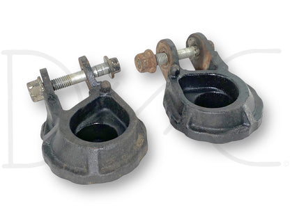 Used 99-07 Ford F250 F350 Front Coil Spring Seat Lower Set Left Right 2WD OEM with visible light wear, designed for truck suspension, featuring metal construction and bolts, suitable for Ford Super Duty models including 7.3L powerstroke diesel engines.