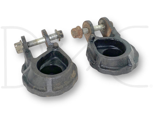 Used 99-07 Ford F250 F350 Front Coil Spring Seat Lower Set Left Right 2WD OEM with visible light wear, designed for truck suspension, featuring metal construction and bolts, suitable for Ford Super Duty models including 7.3L powerstroke diesel engines.