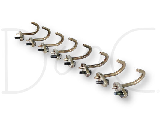 99-02 Ford 7.3 7.3L Diesel Piston Cooling Oil Jet Tube Set W/ Bolts OE Jets [8] showing eight used good condition metal oil jet tubes with bolts arranged in a line, designed for Ford 7.3L Powerstroke diesel engines, compatible with F-250 and other Super Duty trucks.