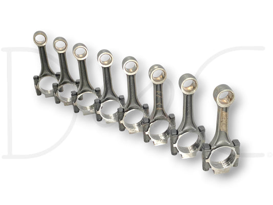 Ford 7.3 7.3L Powerstroke Diesel Camshaft 1812062C3 1818164C1 Cam OE connecting rods arranged in a row showing used condition with light wear for Ford Super Duty trucks.