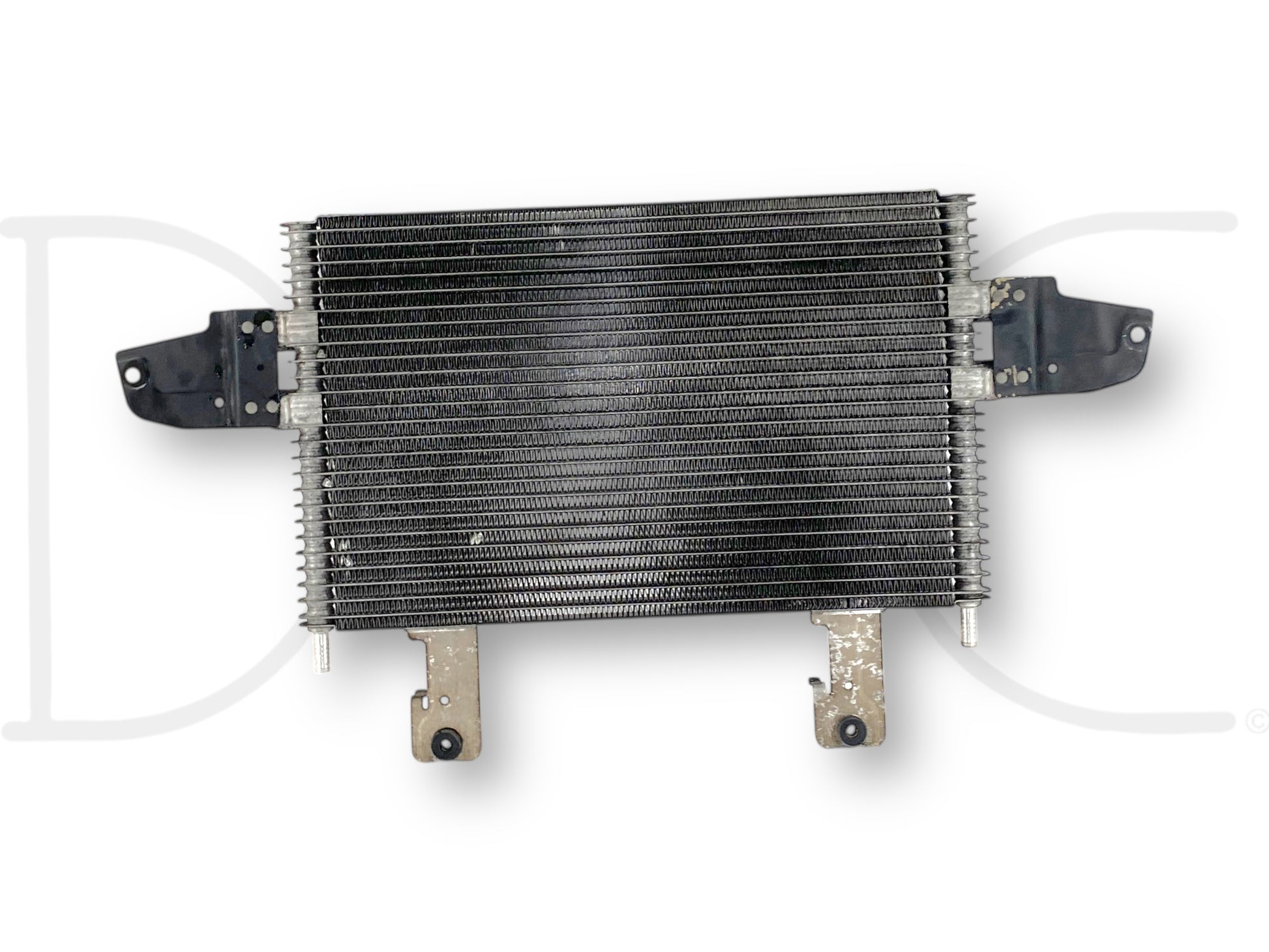 Used OE 05-07 Ford F250 F350 6.0 6.0L Transmission Trans Cooler 5R110 5C34-7A095-Cb with light wear, featuring metal fins and mounting brackets, compatible with Ford Super Duty models including F-250, F-350, F-450, and F-550 from 2005 to 2007.