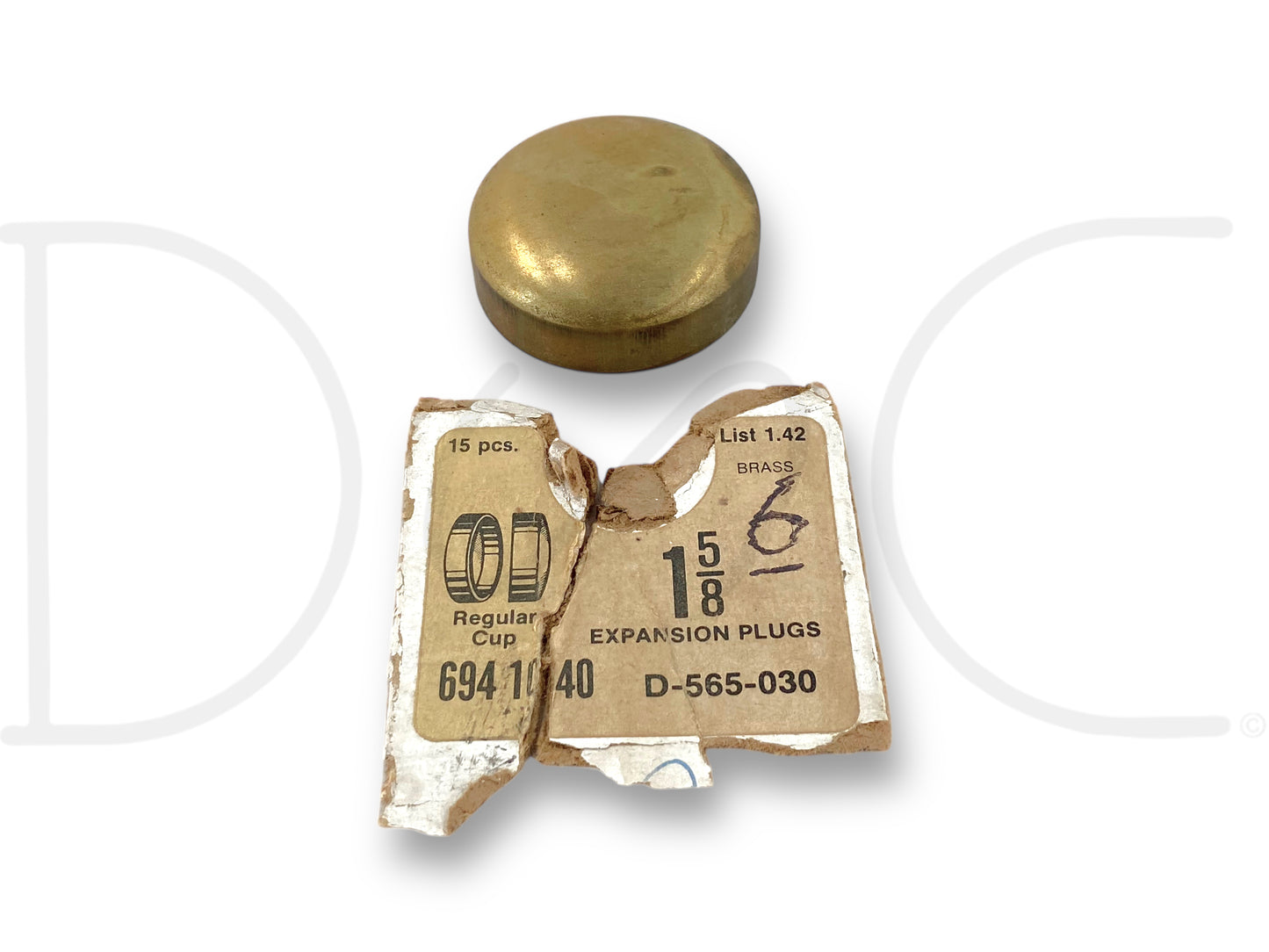 Dorman 565-030 Brass 1-5/8" Freeze Expansion Plug Regular Cup D-565-030 shown with an old stock paper label partially torn, highlighting the brass freeze expansion plug.